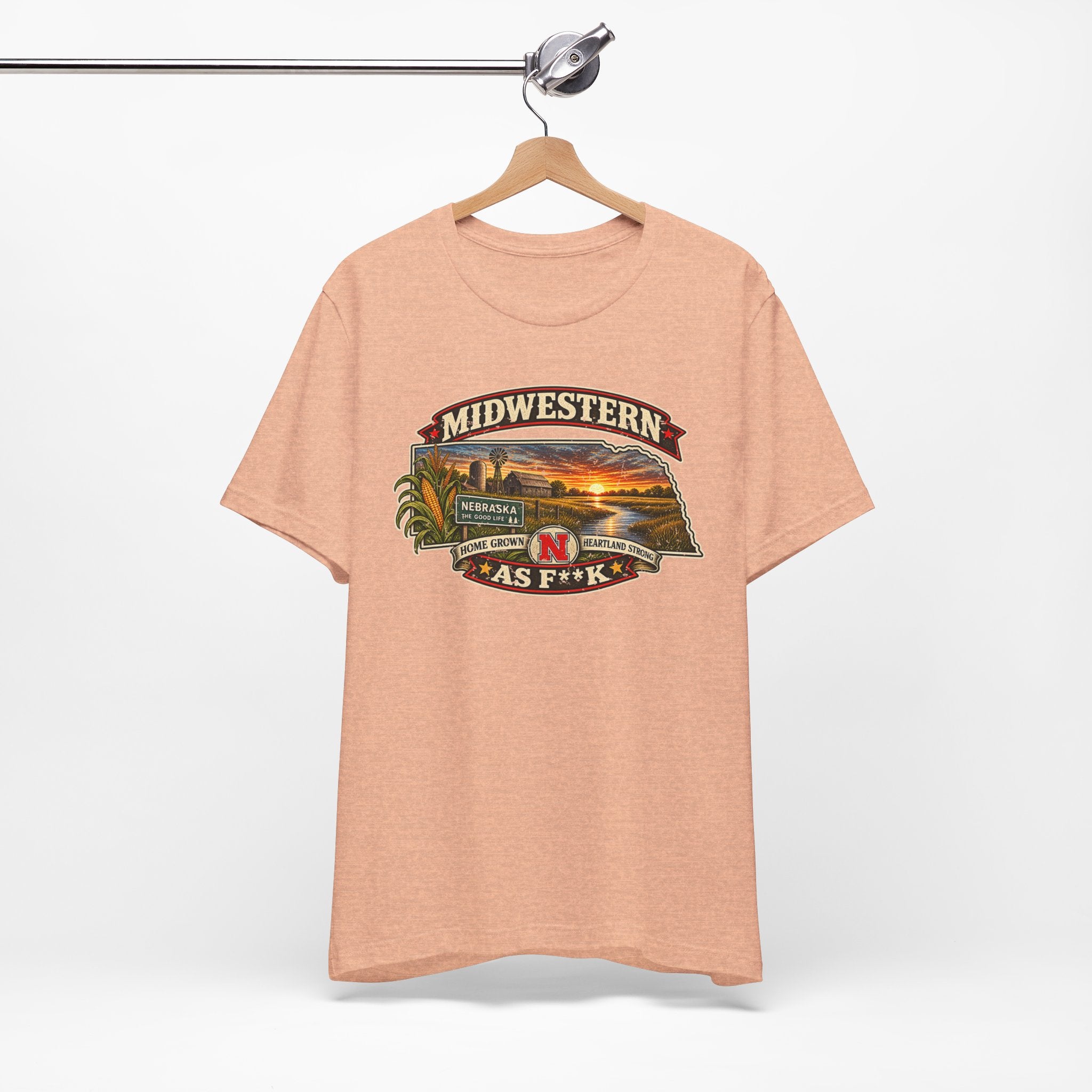 Heather peach Nebraska As F**K tee on a wooden hanger, front print facing out