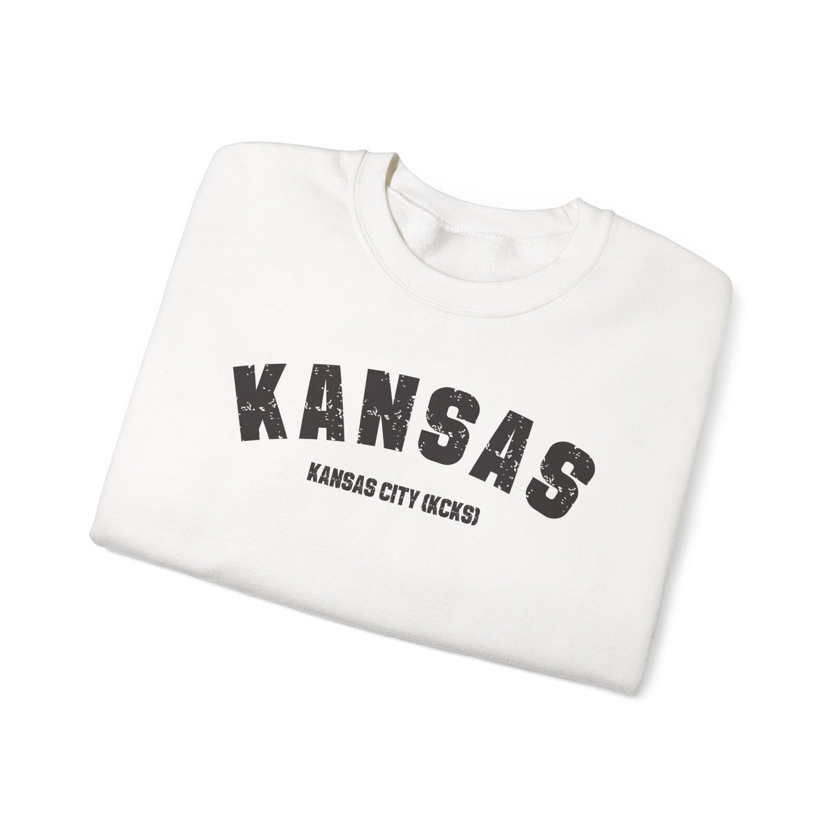 White personalized Kansas crewneck folded, showing the distressed KANSAS arch and KANSAS CITY (KCKS) line