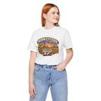 Red-haired woman in the white Kansas AF tee with jeans