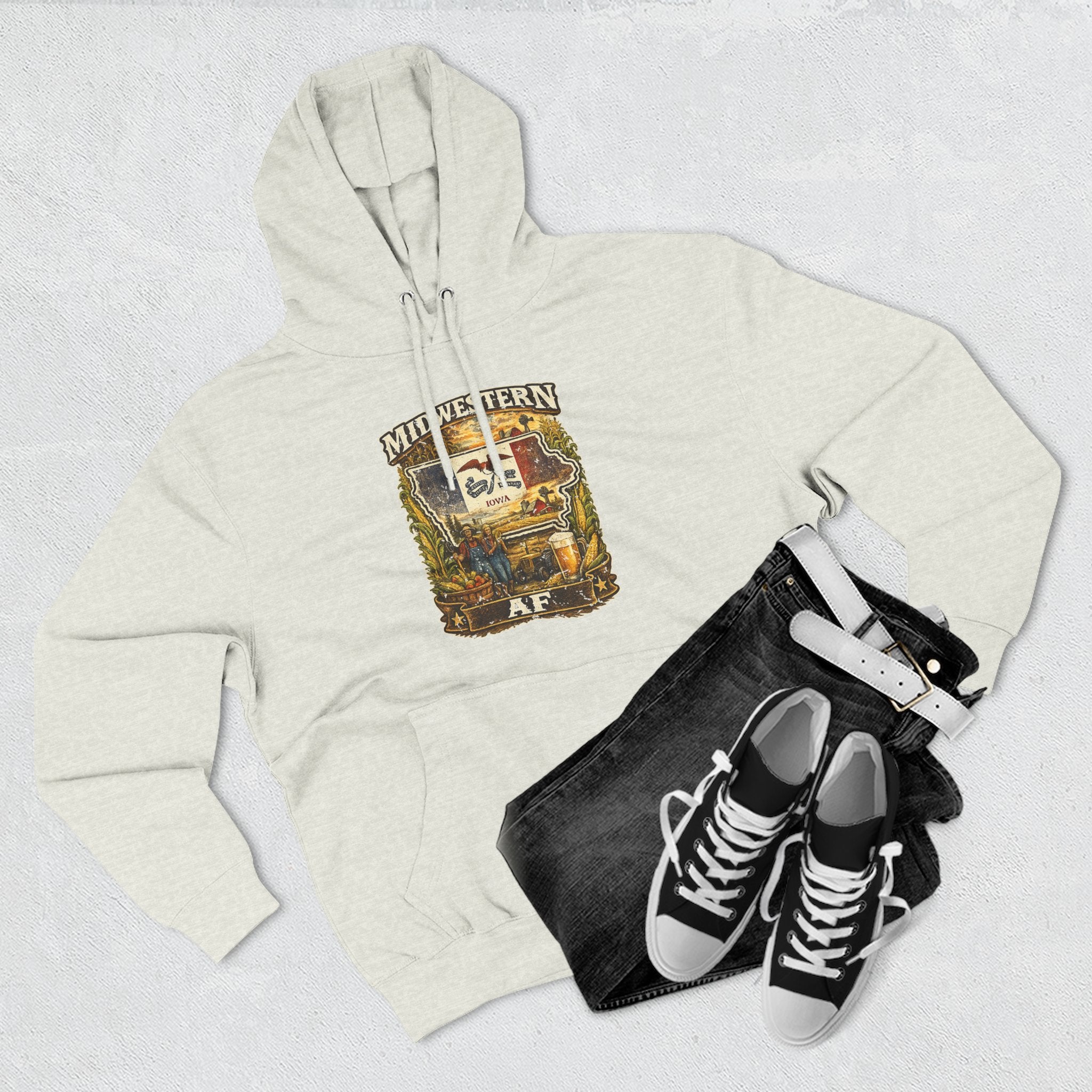 Family Friendly Midwestern AF Iowa Hoodie – product photo 18 featuring a distressed vintage design featuring the outline of Iowa overlaid with the Iowa state flag, surrounded by towering corn stalks, rolling farmland, a classic red barn, a windmill, a tractor, and an overflowing harvest basket