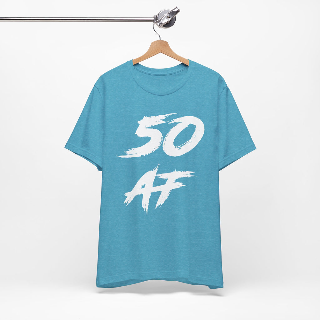 Heather Aqua birthday tee hanging on a hanger, white 50 AF graphic facing front