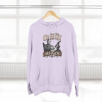 Lilac Country As Fuck hoodie hanging on a wooden hanger by a window
