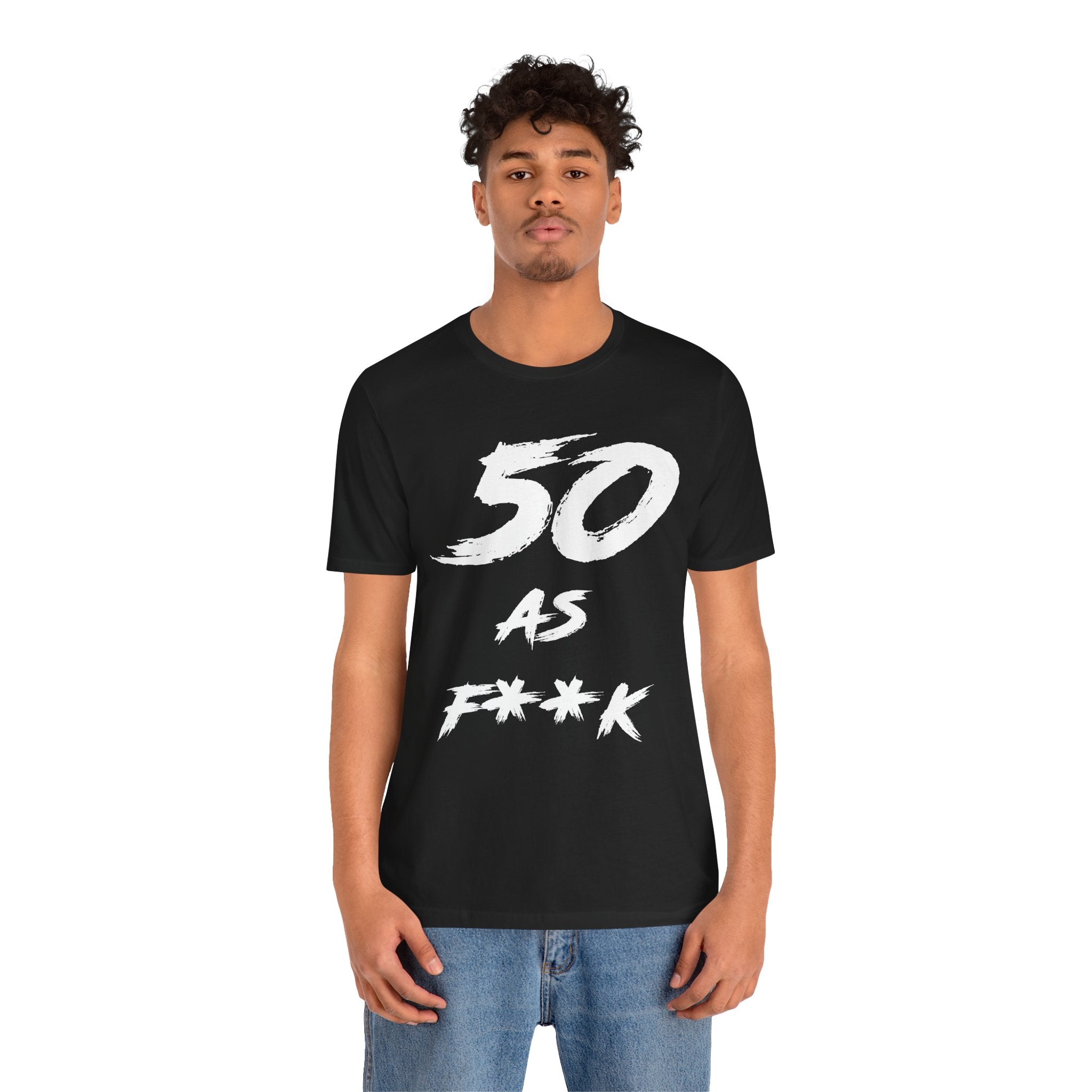 Man wearing the black 50 AS F**K birthday t-shirt with jeans, front view