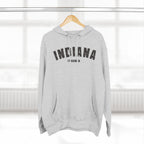 Heather Grey personalized Indiana hoodie on a wooden hanger, charcoal varsity INDIANA and a hometown line