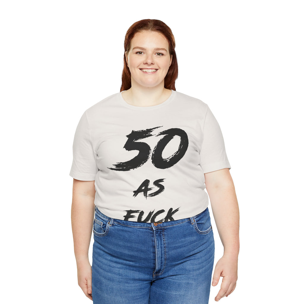 Smiling woman wearing the Vintage White 50 AS FUCK birthday tee with jeans
