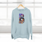 Pale blue hoodie hanging on a wooden hanger, bold B with a Brooklyn Bridge sunset skyline graphic.