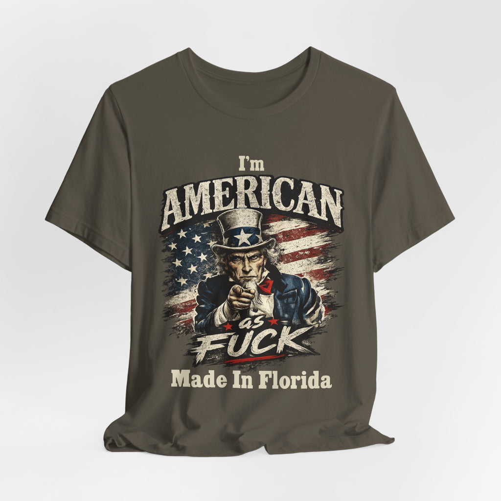 Army green t-shirt laid flat with soft wrinkles, showing the Uncle Sam graphic and text below