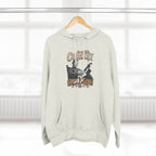 Oatmeal Heather Country AF hoodie on a wooden hanger by a window
