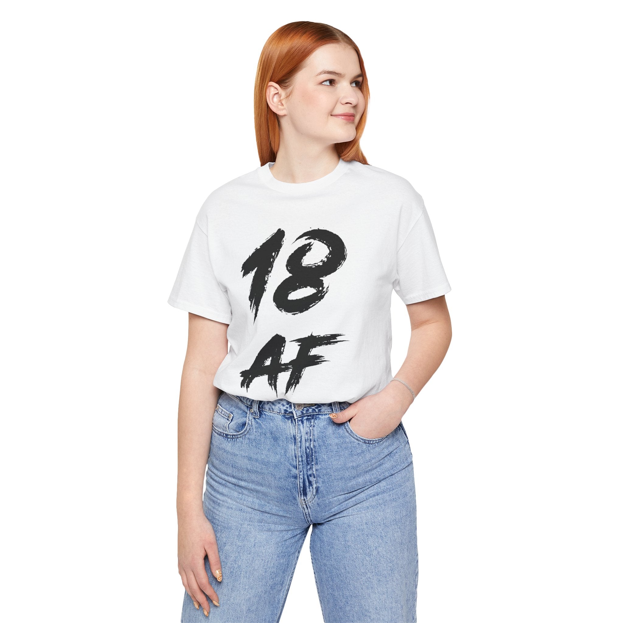 Red-haired woman wearing the white 18 AF birthday tee with blue jeans