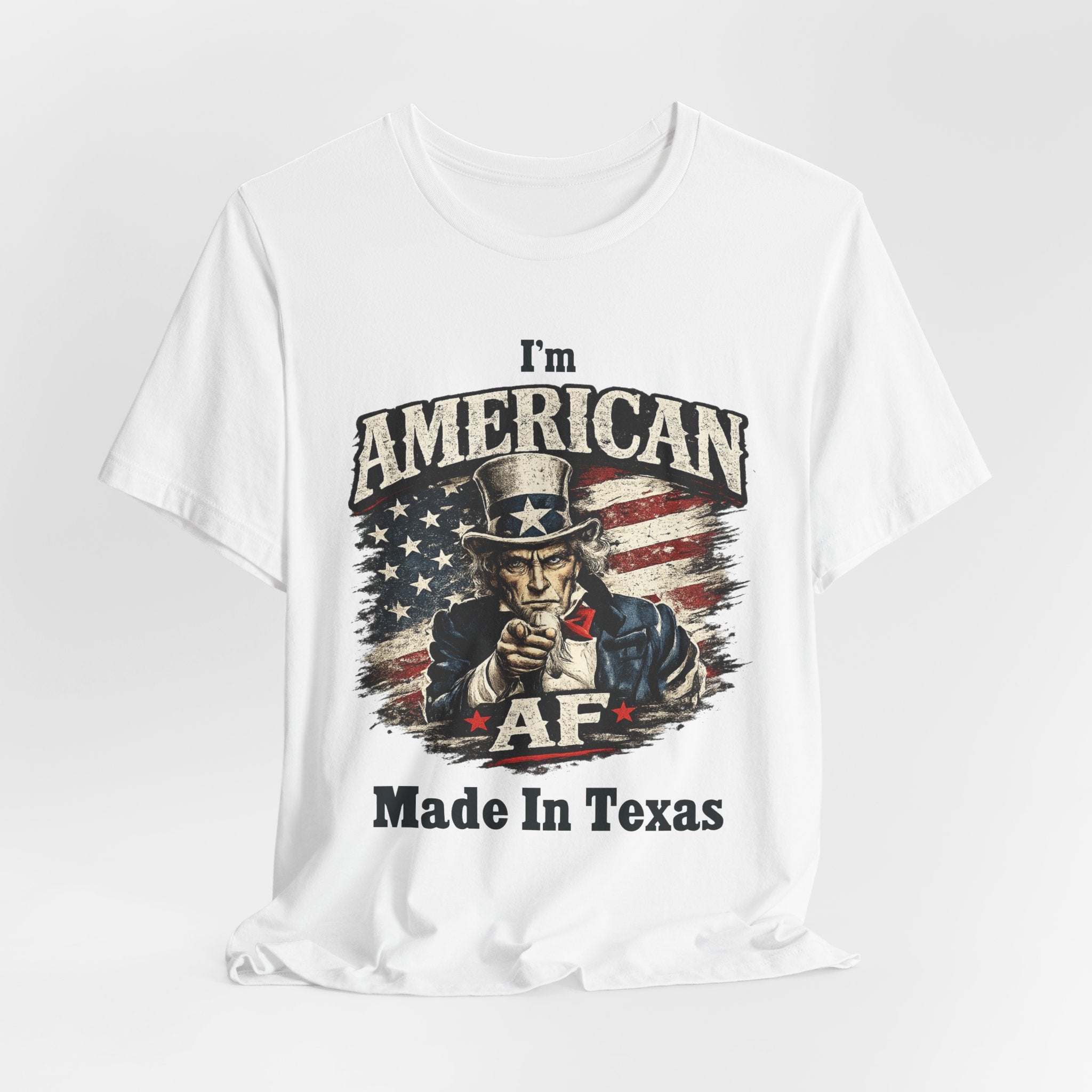 Military green flat lay tee showing Uncle Sam pointing graphic and 'Made In Texas' text