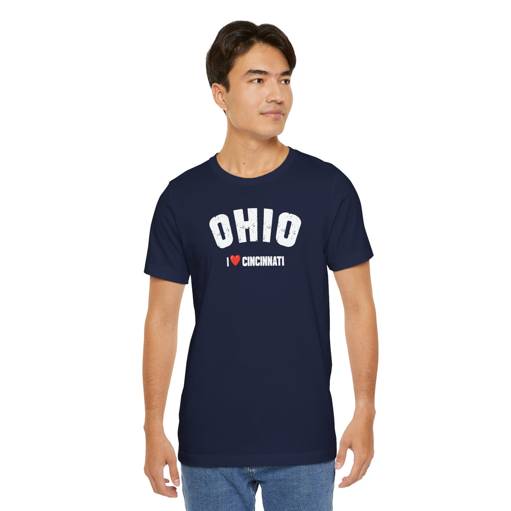 Man in the navy Personalized Ohio tee and jeans, plain studio background