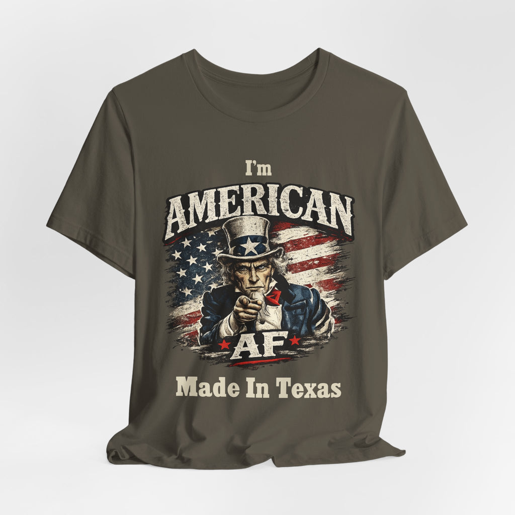 Mustard yellow t-shirt casually draped, showing the Uncle Sam graphic and AF Made In Texas text.