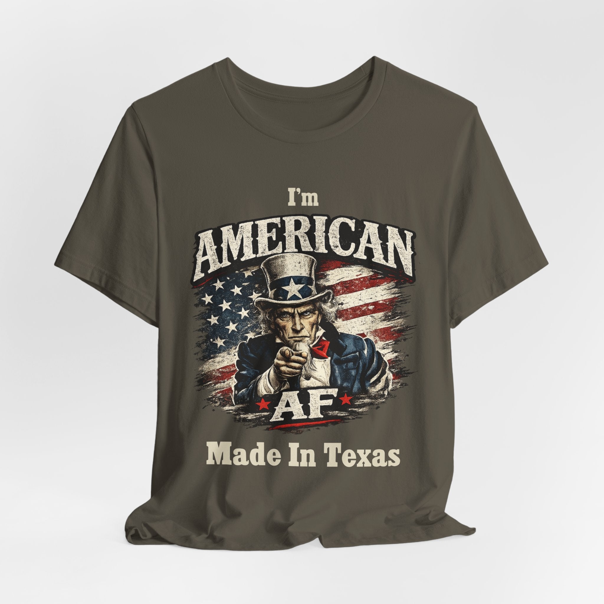 Mustard yellow t-shirt casually draped, showing the Uncle Sam graphic and AF Made In Texas text.