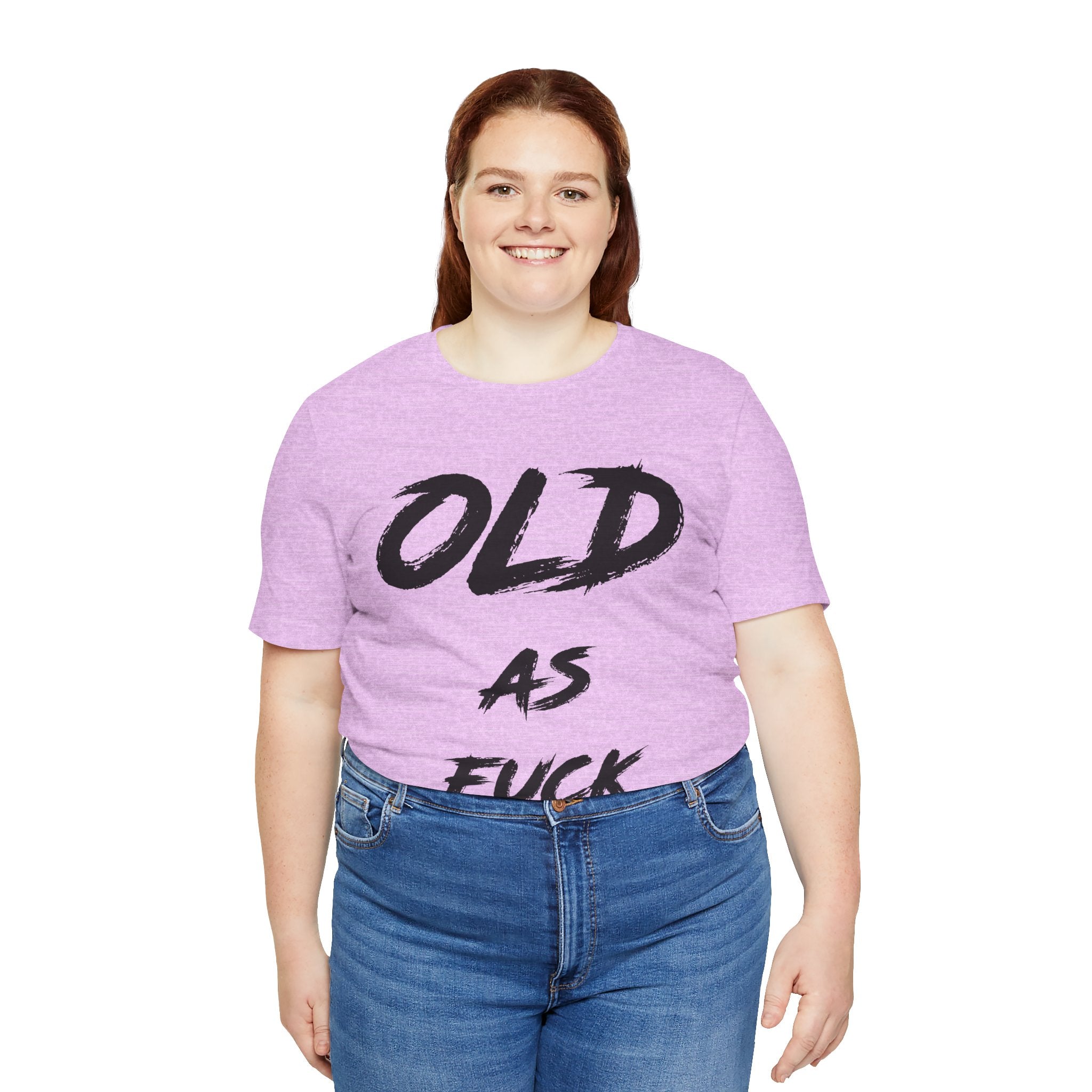 Smiling woman in the lilac birthday tee customized to read OLD AS FUCK