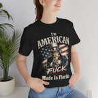 Close-up of a black t-shirt worn by a smiling female model, with Uncle Sam print near a plant