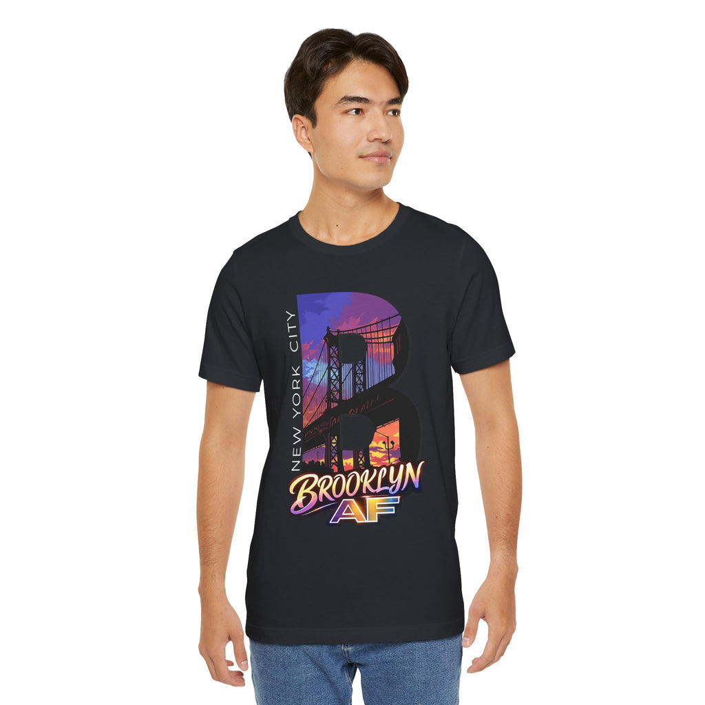Black t-shirt worn by a model, front view showing the full 'B' Brooklyn Bridge sunset skyline graphic and logo
