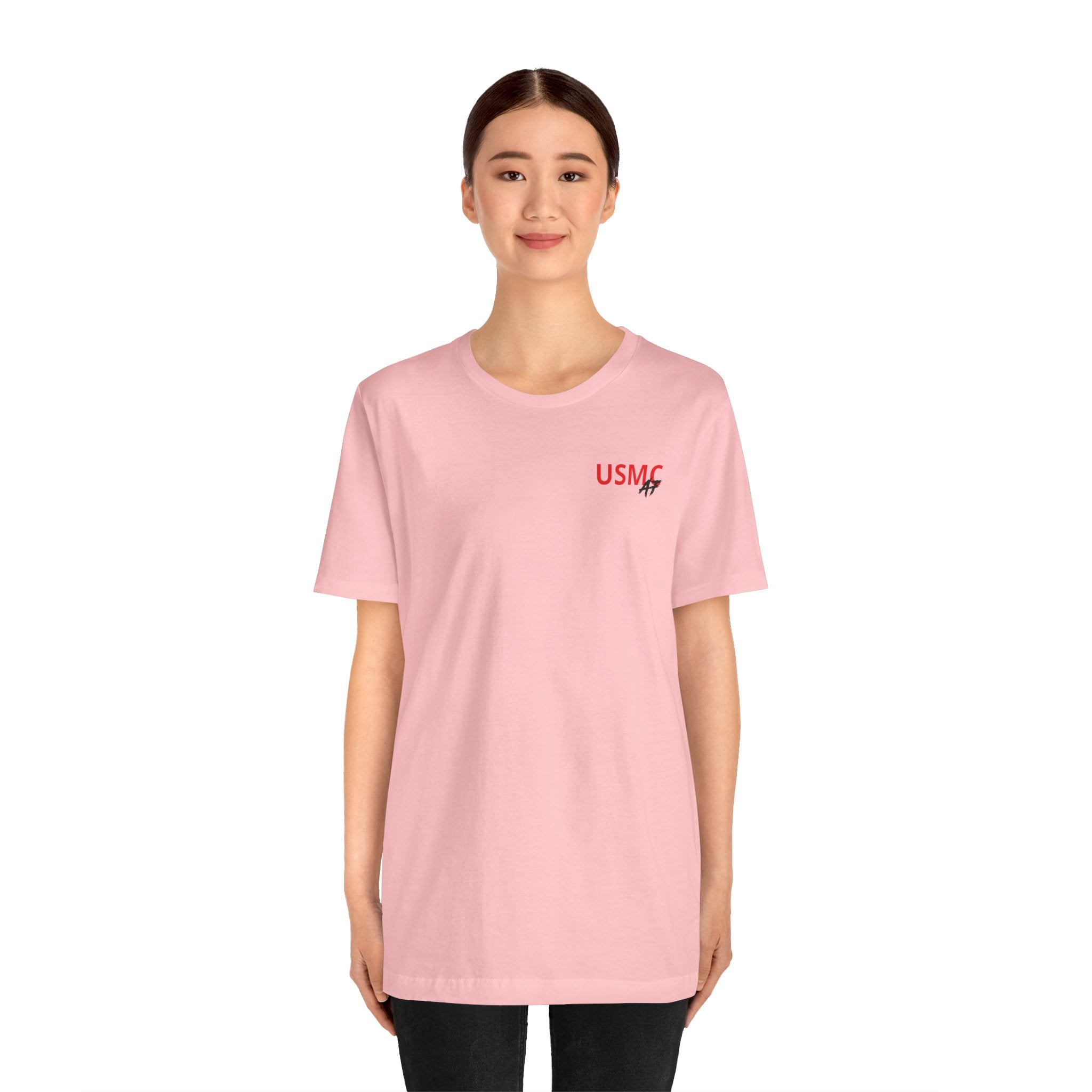 Woman wearing the personalized Marine Corps veteran T-shirt in Pink, full-length studio shot