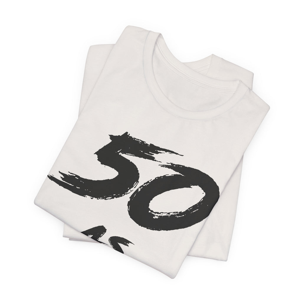 Folded Vintage White tees stacked, black 50 print visible on the top fold
