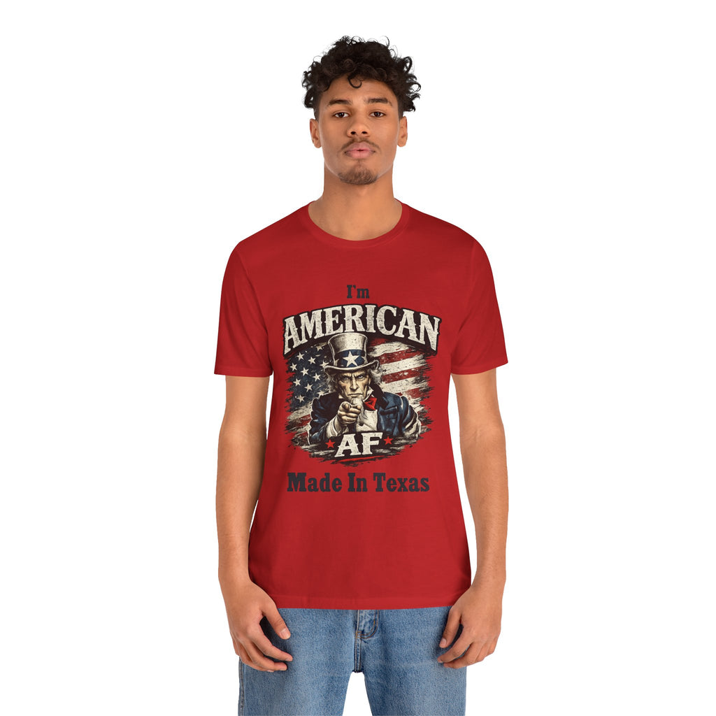 Folded stack of black tees showing a partial view of the Uncle Sam graphic and 'I'm American' text