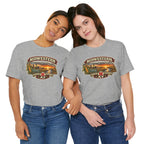 Two women in athletic heather Nebraska tees, front print of the vintage Nebraska farm badge