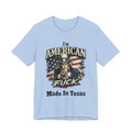 Light blue flat lay tee with Uncle Sam graphic and "I'm American As Fuck, Made In Texas" text