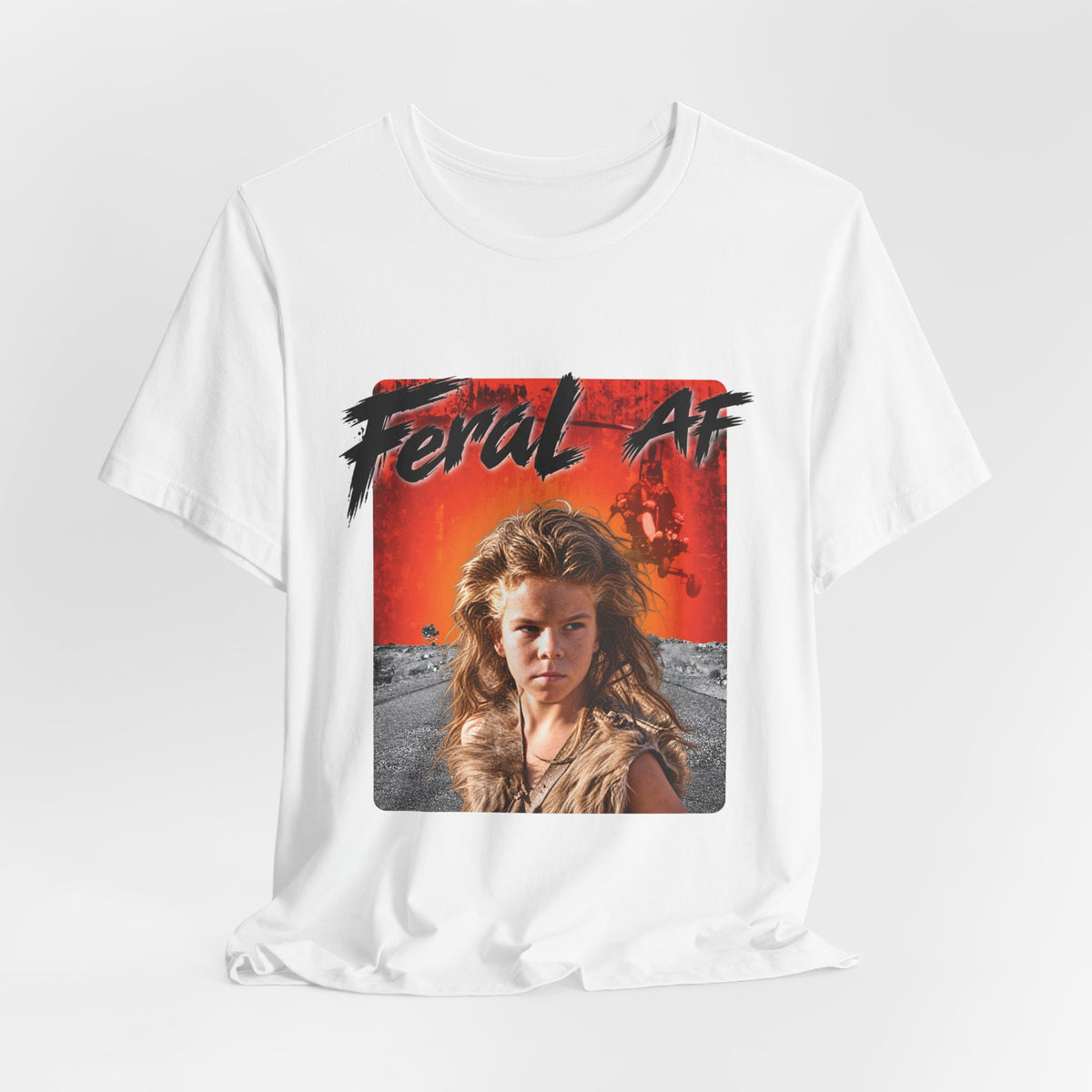 White Feral AF T-shirt arranged on a pale backdrop, the front print shown in full colour