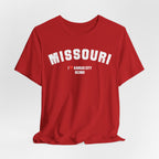 Red custom Missouri t-shirt draped on grey, white varsity MISSOURI lettering above I heart KANSAS CITY