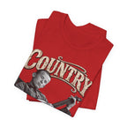 Red Country As Fuck tee folded in a stack, COUNTRY lettering across the fold