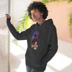 Black hoodie worn by a female model outdoors, side view with hand on a fence, oversized "B" skyline graphic on chest.