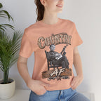 Woman beside a plant in the Heather Peach Country AF tee