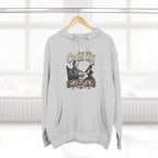 Heather Grey Country As Fuck hoodie on a wooden hanger by a window