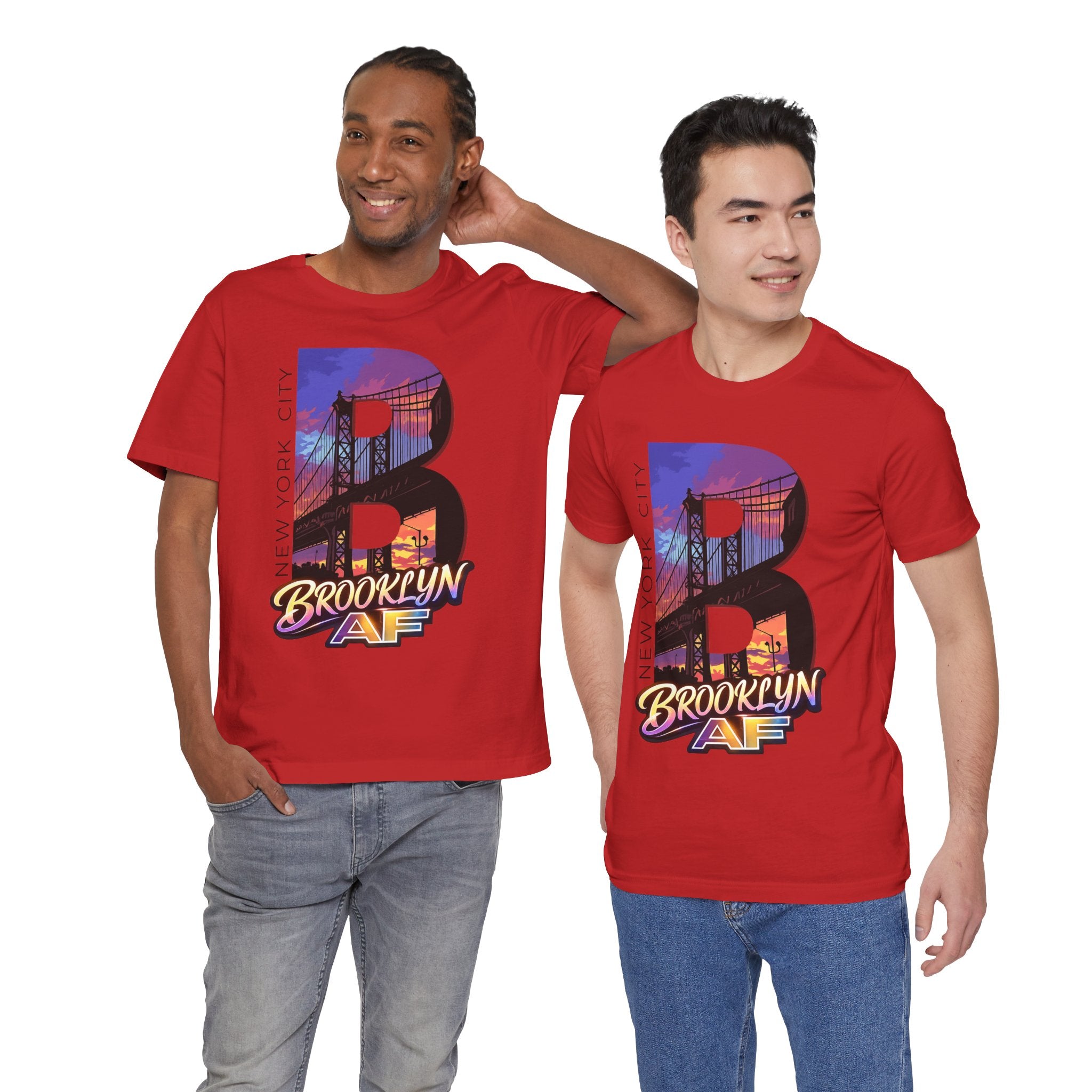 Red t-shirts worn by two male models, front view, each with a bold "B" Brooklyn Bridge sunset skyline graphic.