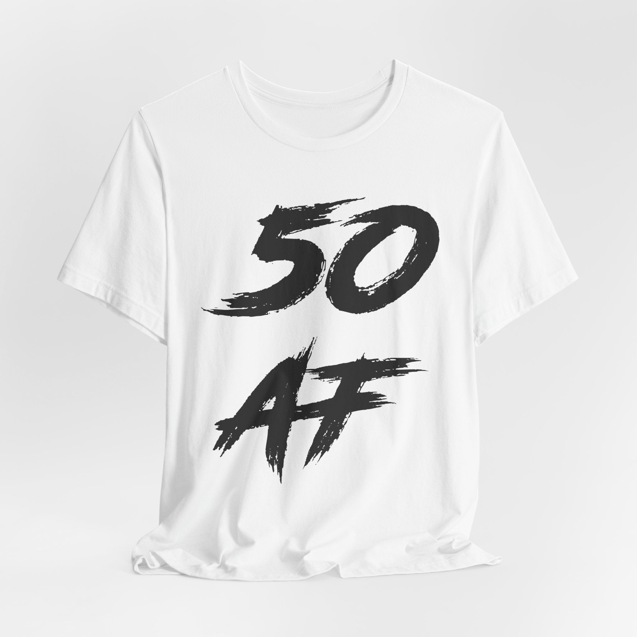 White birthday t-shirt laid flat with the black brush-script 50 AF print