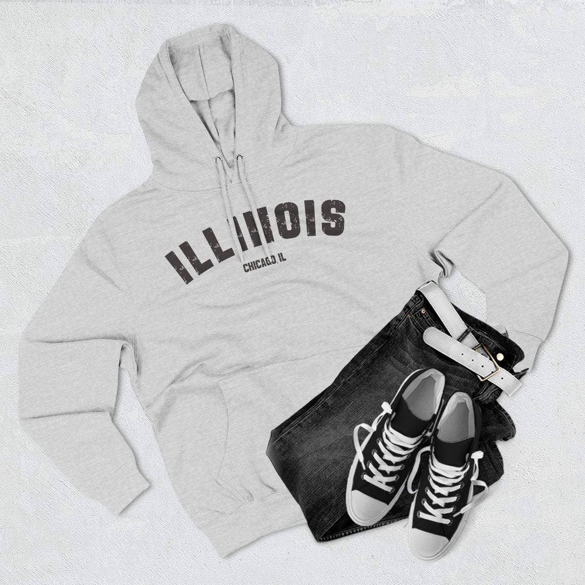 Heather Grey Illinois hoodie styled flat with jeans and sneakers, charcoal ILLINOIS and a Chicago IL line