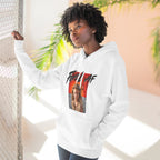 Woman wearing the White Feral AF hoodie indoors beside a palm, fiery wasteland print on her chest