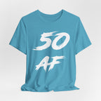 Close crop of the Heather Aqua tee laid flat, white 50 AF brush strokes in detail