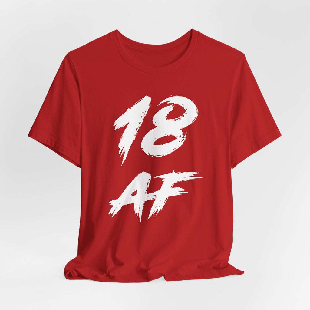 Red birthday t-shirt laid flat and slightly rumpled, white 18 AF graphic