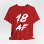 Red birthday t-shirt laid flat and slightly rumpled, white 18 AF graphic