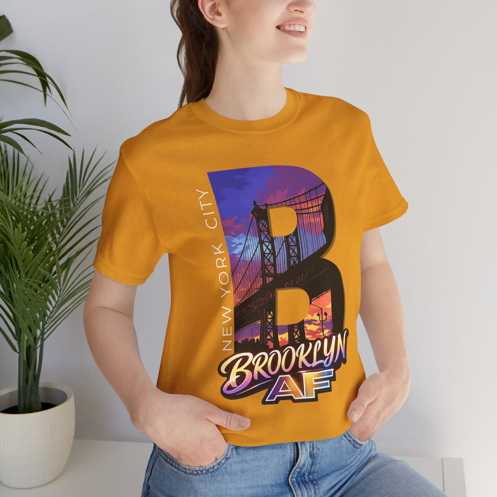 Mustard yellow t-shirt worn by a female model near a potted plant, front view, Brooklyn Bridge sunset B graphic.