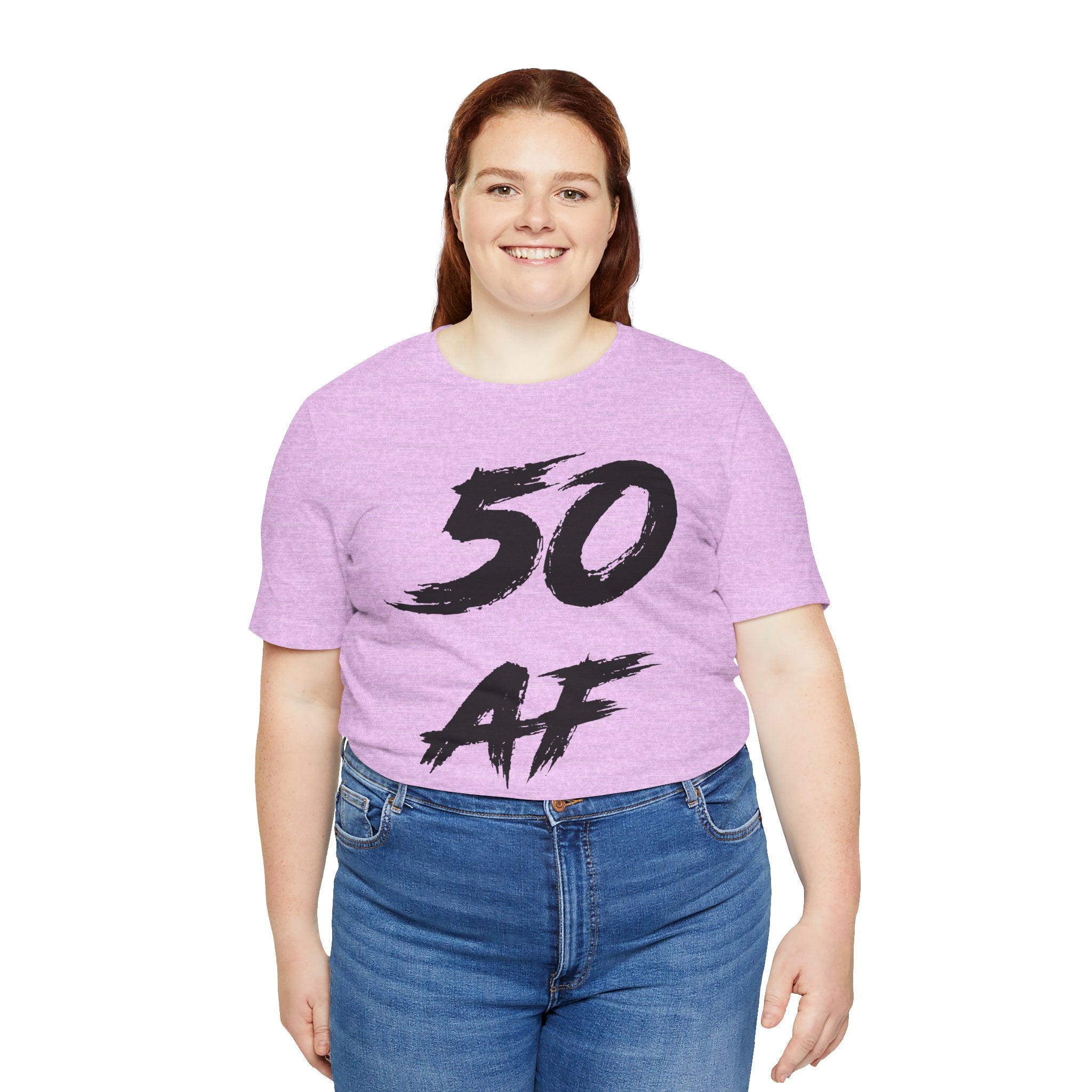 Smiling woman in the Heather Prism Lilac 50 AF tee with the black front print