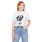 Red-haired woman wearing the white 18 AS F**K birthday tee with blue jeans
