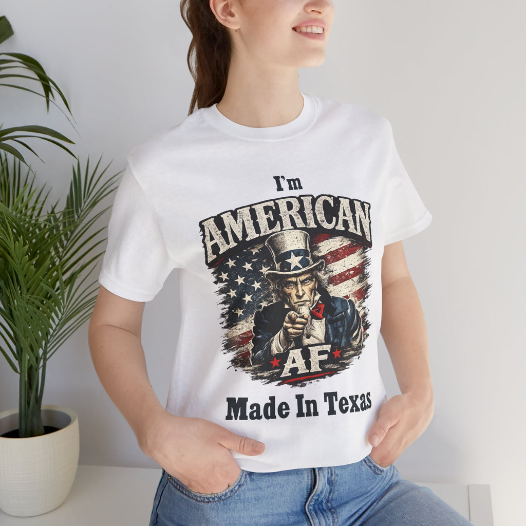 Close-up of a female model in a white tee with the Uncle Sam graphic and 'Made In Texas' text