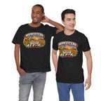 Two men wearing black Kansas As F**K T-shirts with the prairie sunset badge