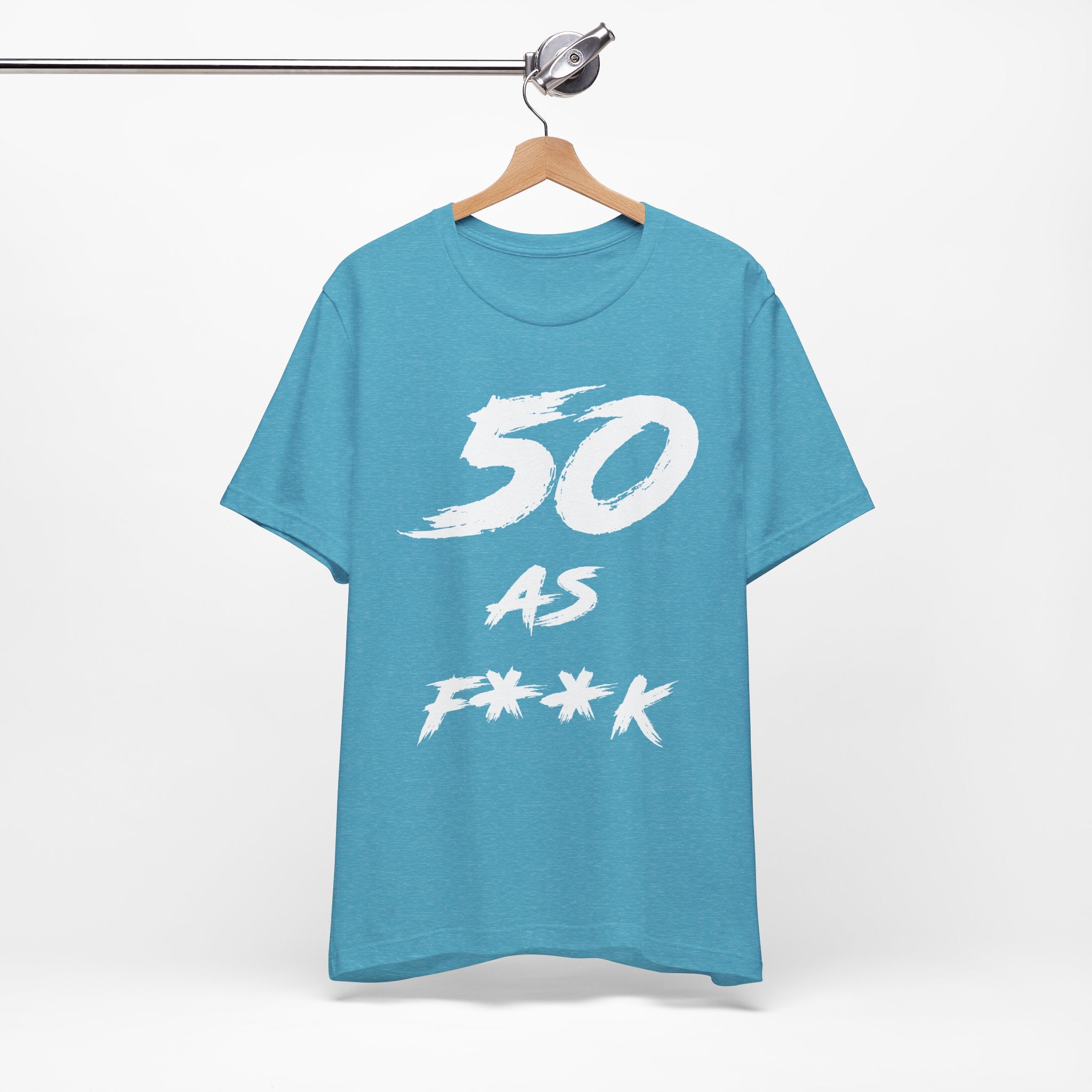 Heather Aqua birthday tee hanging on a hanger, white 50 AS F**K graphic facing front