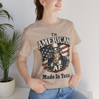 Close-up of a female model in a tan tee with the Uncle Sam graphic and 'Made In Texas' text