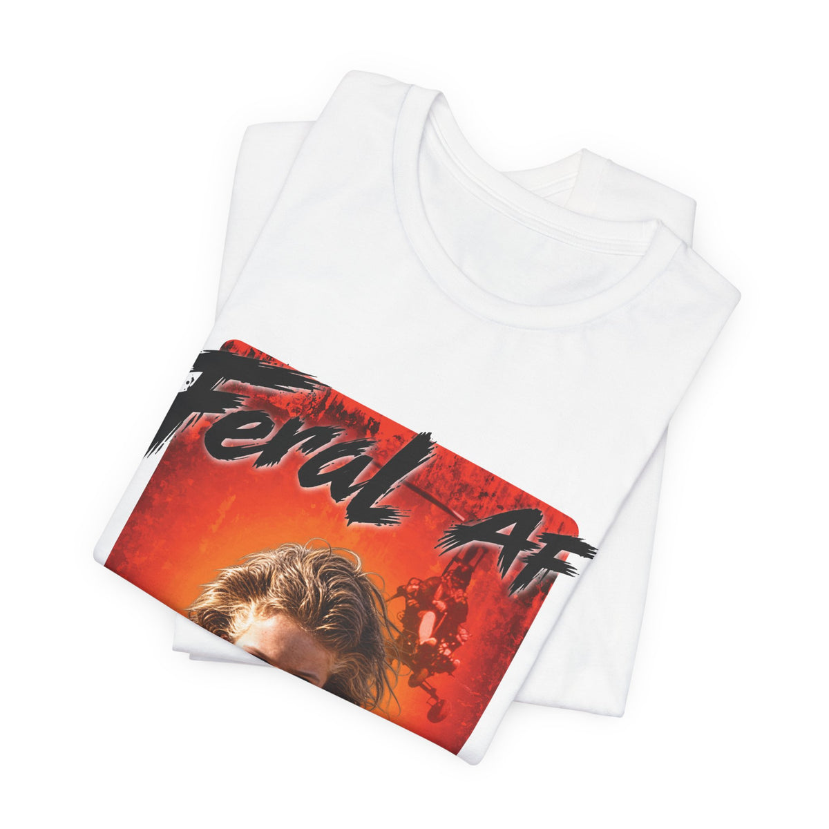 White Feral AF tee folded with the front graphic panel resting on top of the stack