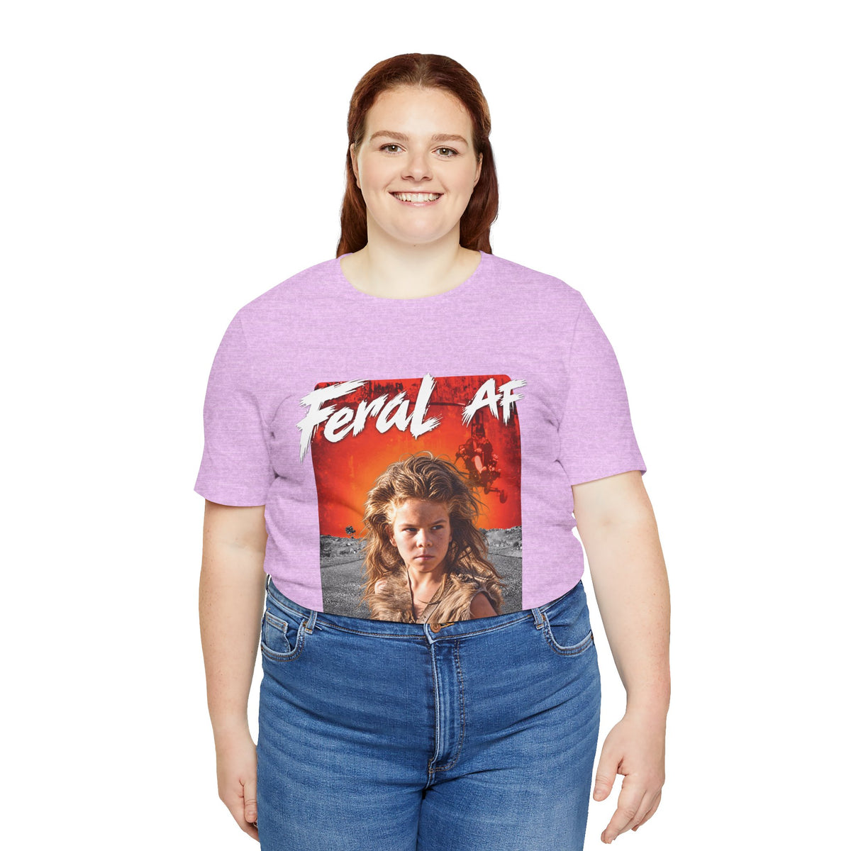 Woman wearing the Heather Prism Lilac Feral AF tee, pale purple fabric with the fiery front print