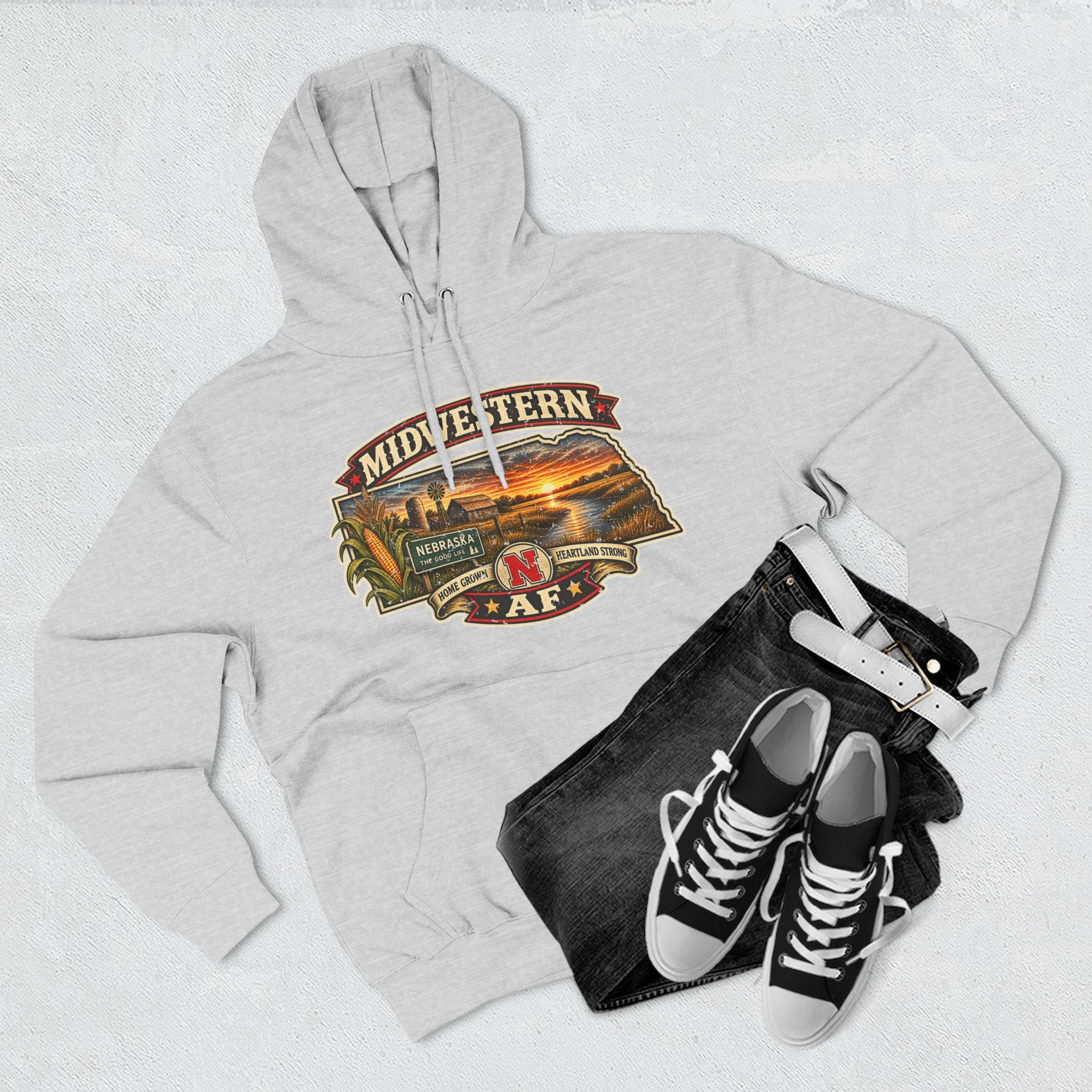 Heather grey Nebraska hoodie styled flat with black jeans and sneakers