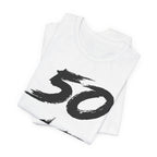 Folded white birthday tees stacked, the black 50 print showing on the top fold