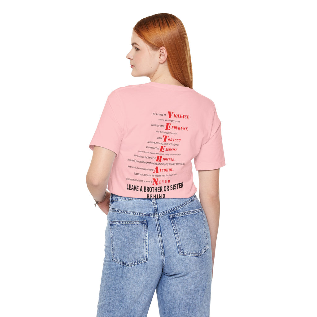 Woman wearing the Marine Corps veteran T-shirt in Pink, back view showing the VETERAN acrostic print